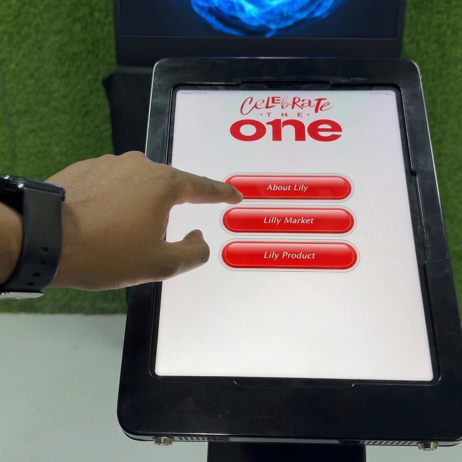 AI kiosk at an event features a digital display of a ai hologram woman in a blue hijab